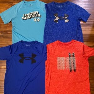 (4) boys size large Under Armour dri-fit shirts. Near perfect condition